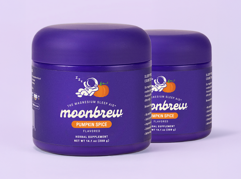 Angled front view of two Moonbrew Pumpkin Spice tubs showing purple packaging and flavor label on a pale purple background