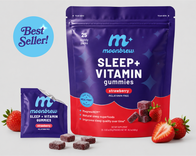 Front view of MoonBrew Sleep Plus Vitamin strawberry melatonin-free gummies pouch with sachet and strawberries on white