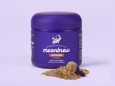 Front view of MoonBrew Cappuccino magnesium sleep aid powder tub with purple container and scoop on pale purple background